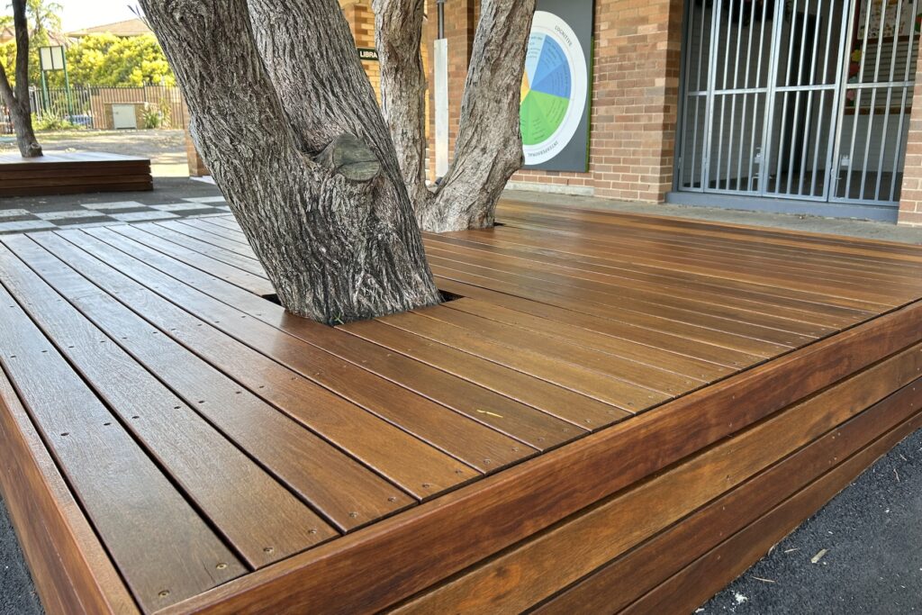 Professionally stained deck which was built around the existing trees