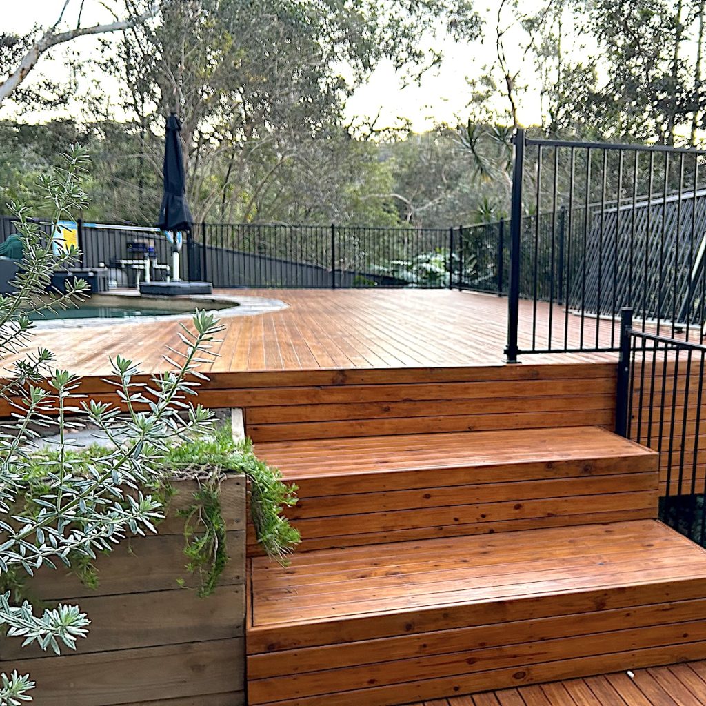 Tranquil setting of a pool side deck in Sutherland Shire with focus on a planter box and large steps